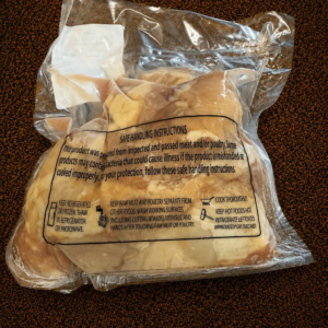 Raw chicken with safety instructions