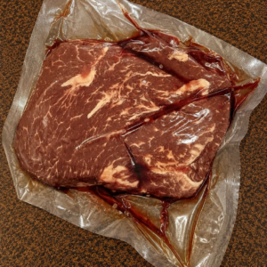 Fresh steak on brown surface