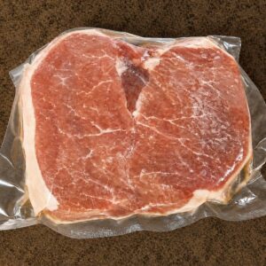 Packaged pork chop on countertop