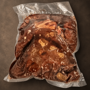 Vacuum-sealed frozen meat with marinade