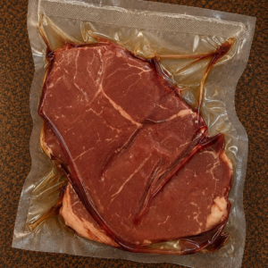 Vacuum-sealed raw beef steak