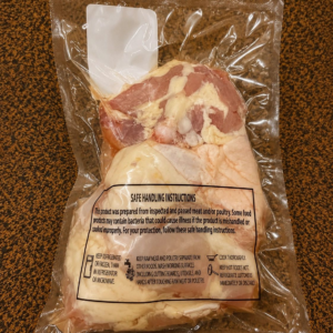 Raw chicken with handling guidelines