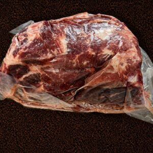 Raw meat wrapped in plastic