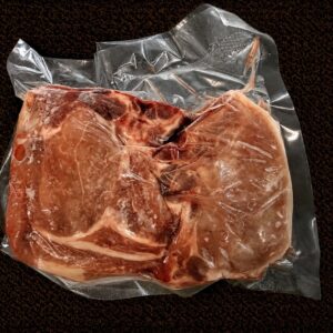 Frozen steak in vacuum-sealed packaging