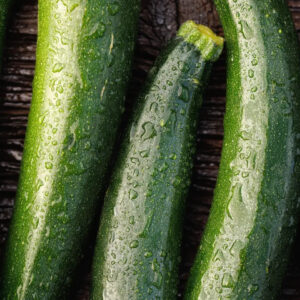 Close-up green zucchinis with water droplets