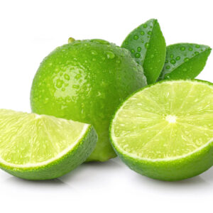 Fresh green whole and sliced limes with leaves